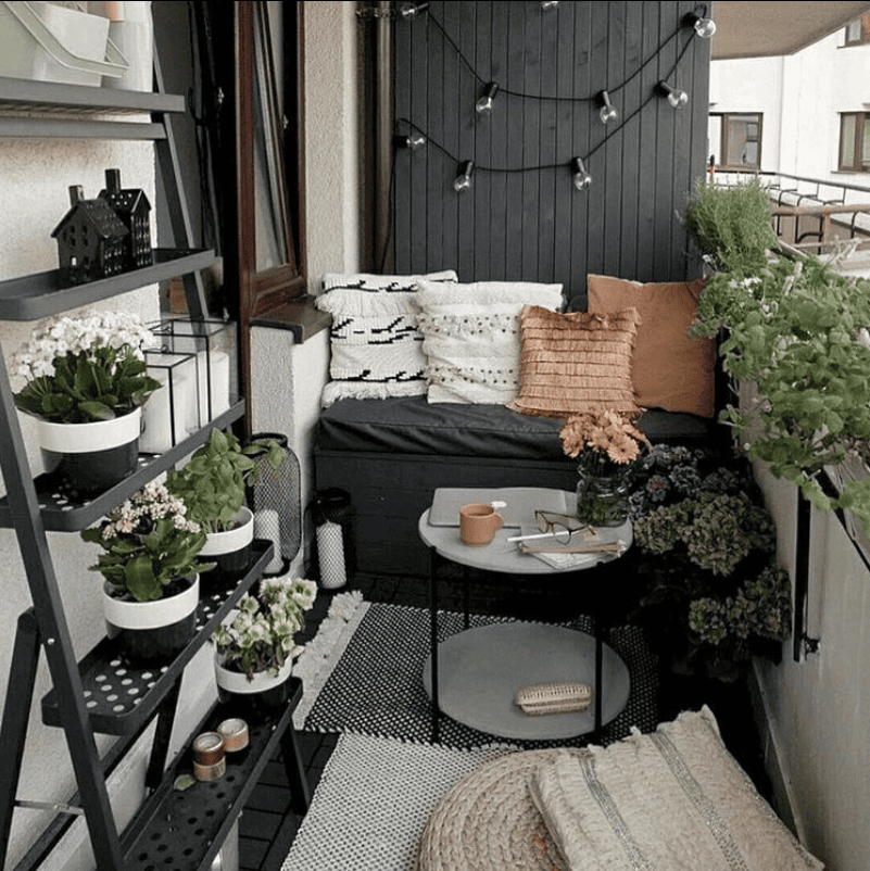 Cozy Contemporary Balcony Escape with Greenery and Twinkling Lights
