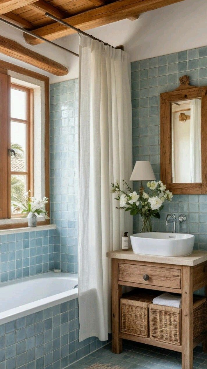 Bathroom with blue tiled walls and natural wood window trim, vanity, and mirror frame.