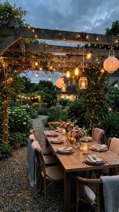 Backyard lounge area with warm string lights and illuminated seating at night
