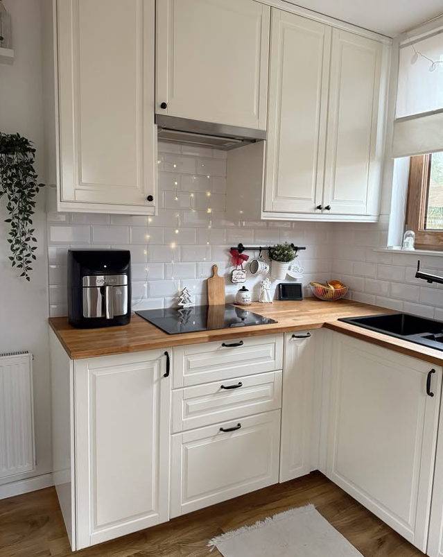 Bright White Kitchen Featuring Rich Wood Countertops