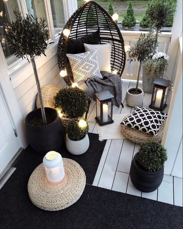 Cozy Contemporary Balcony with Lantern Light and Egg Chair