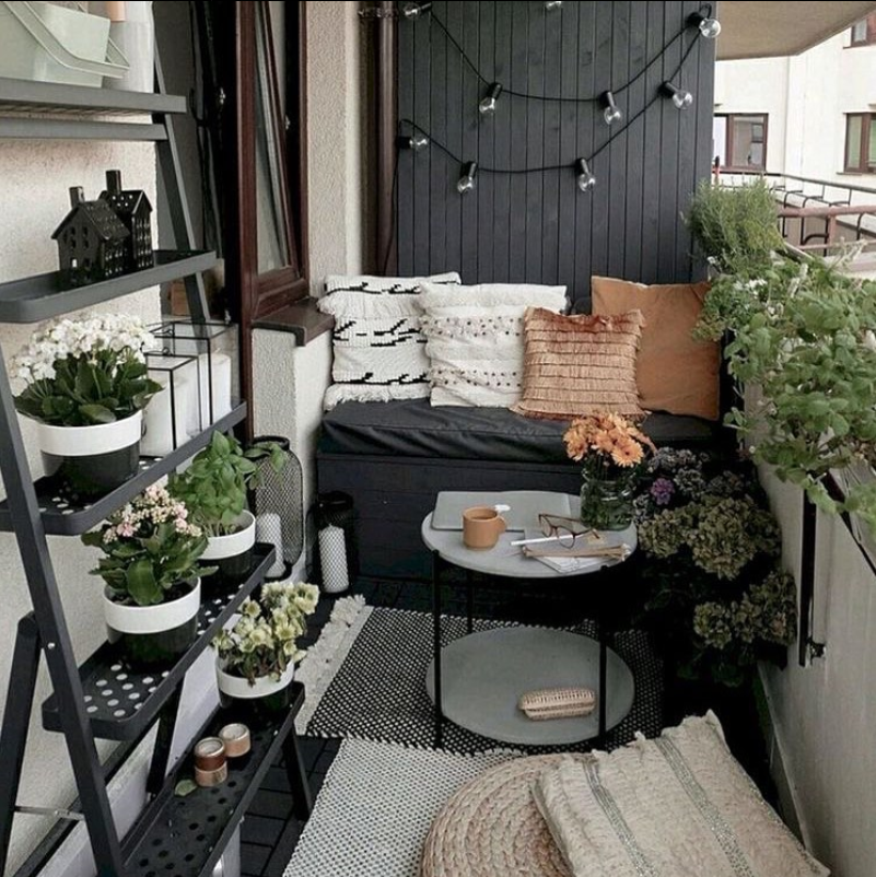 Cozy Contemporary Balcony Escape with Greenery and Twinkling Lights