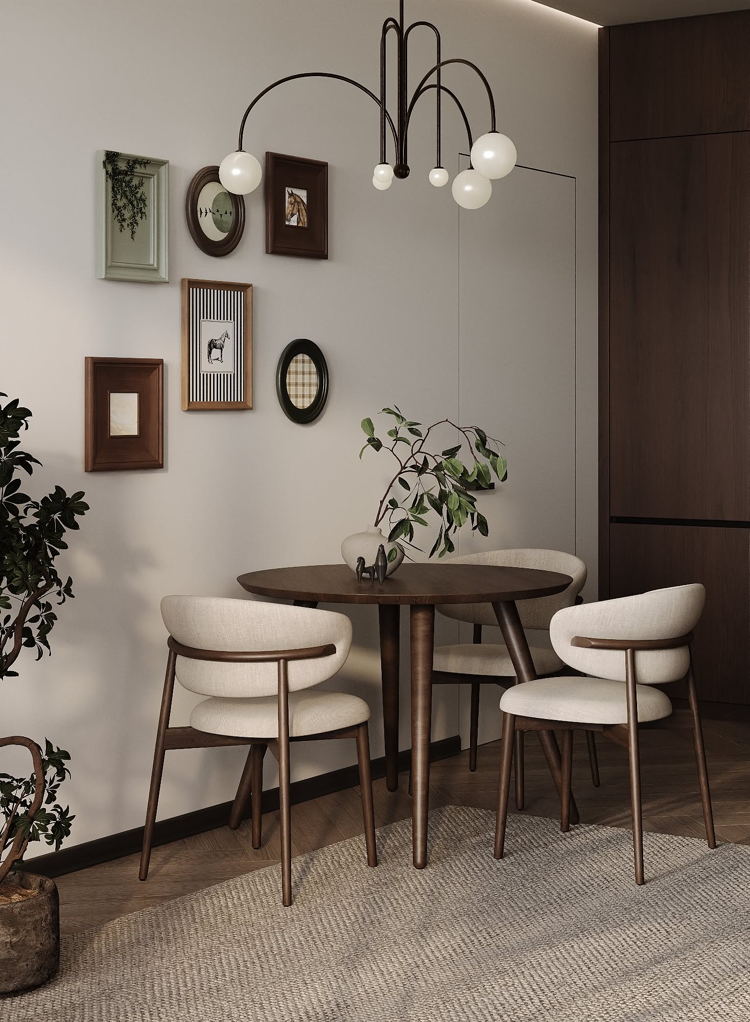 Small dining room with a round wooden table, three upholstered chairs, an arched chandelier, and a gallery wall.