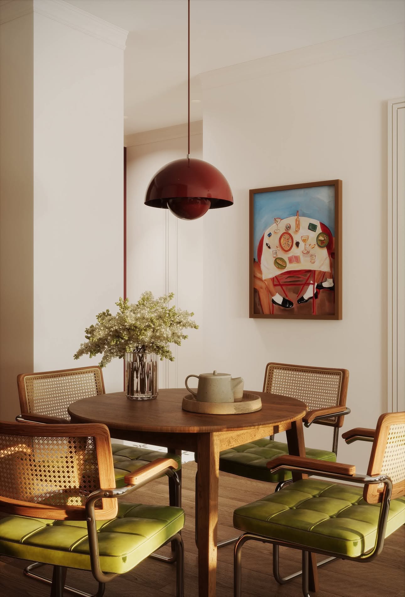 Round wooden dining table with four chairs, a vase of white flowers, and a teapot set under a red pendant light.