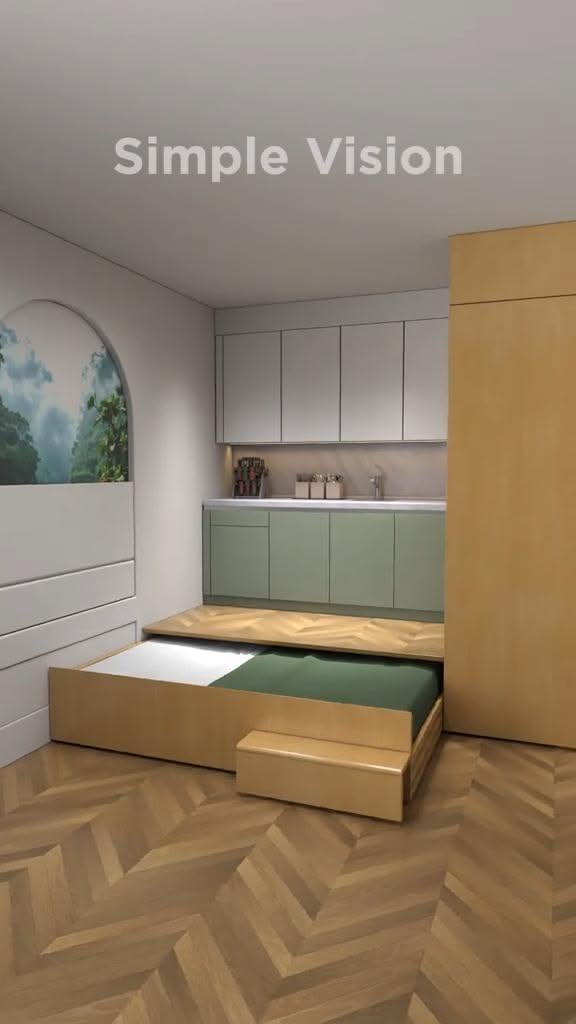A pull-out bed with a green mattress visible, extending from a wooden frame below a compact kitchen setup.