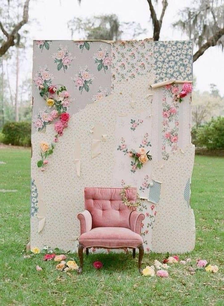 Wooden freestanding photo booth frame with a wide base on grass