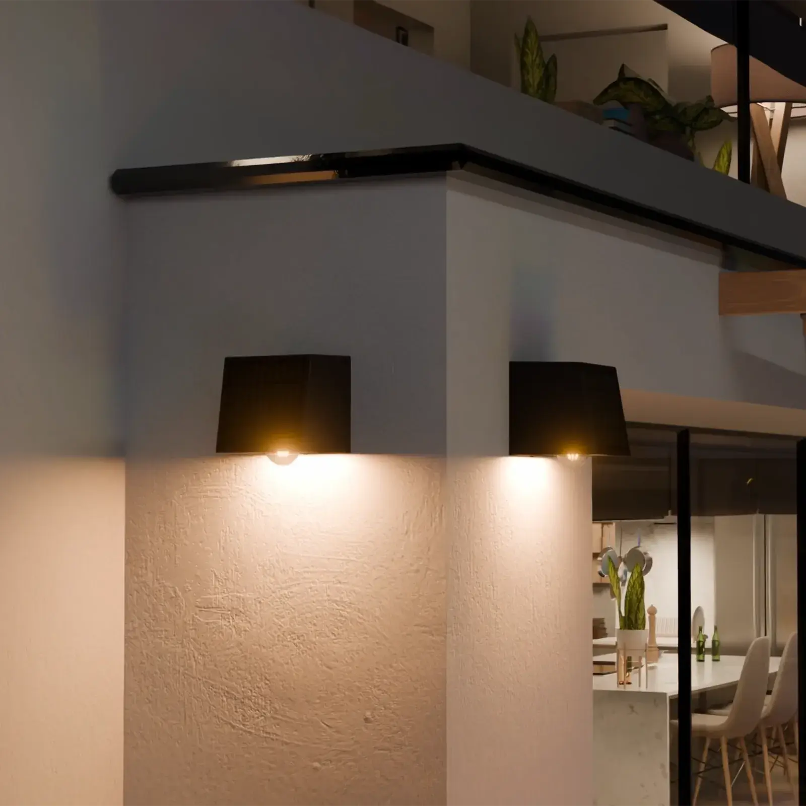 Black outdoor solar wall light mounted on a white exterior wall