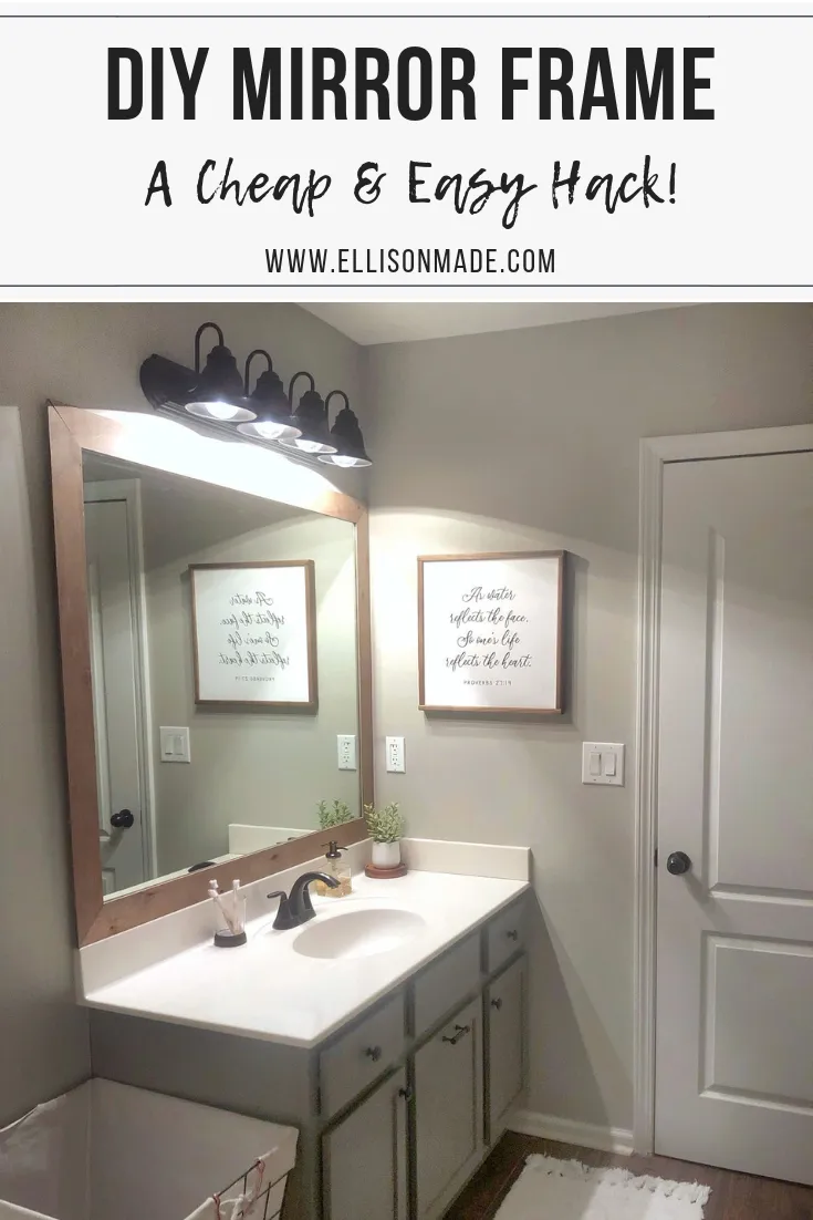 Rectangular wood-framed mirror above a bathroom vanity with a sink, faucet, and soap dispenser.