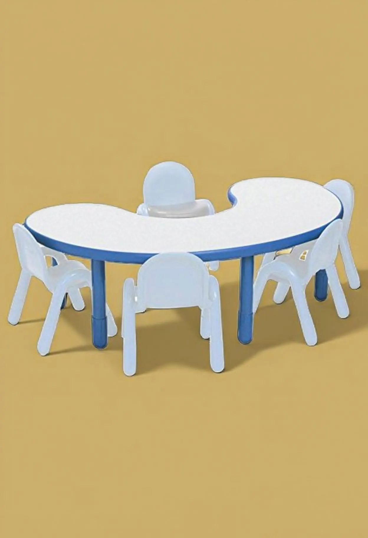 Kidney-shaped white children's activity table with blue trim and legs, surrounded by several small white plastic chairs.